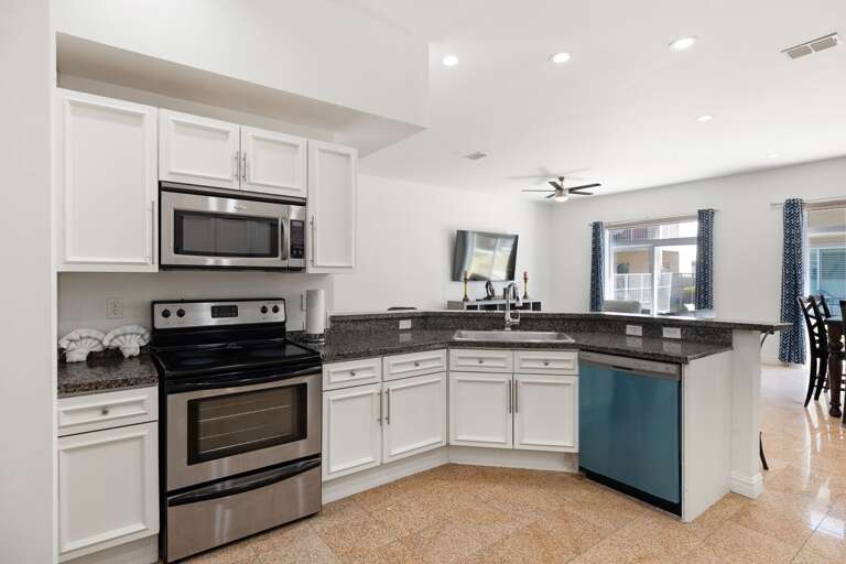 Fully equipped kitchen with granite counter tops and  stainless steel appliances