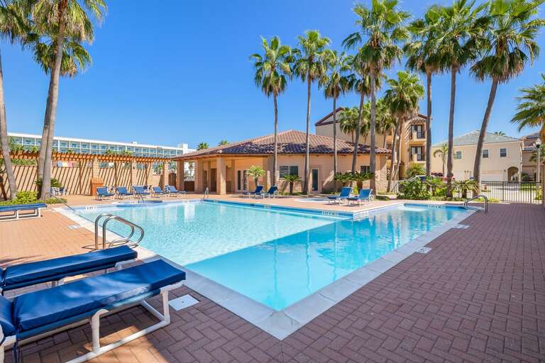 Large community pool with lounge chairs that get plenty of sun during the day!