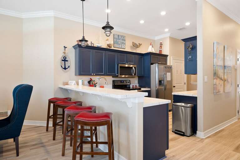 Fully stocked kitchen with pots, pans, and utensils to prepare home cooked meals!