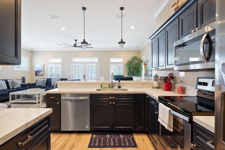Kitchen is fully stocked with pots, pans, and cooking utensils!