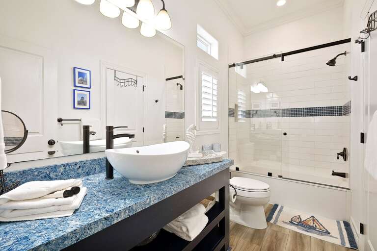 Private bathroom attached to the guest bedroom (Santorini) features a combination shower.