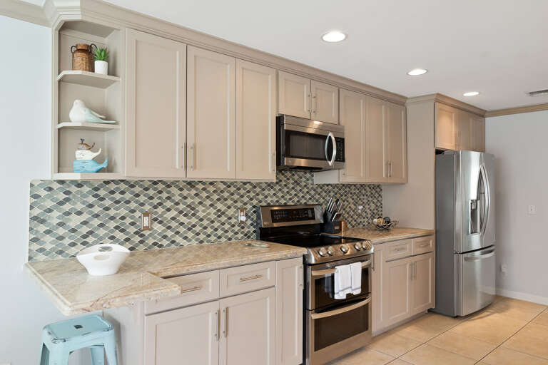 2nd floor kitchen off the dinning area. Featuring two separate ovens, and microwave oven.