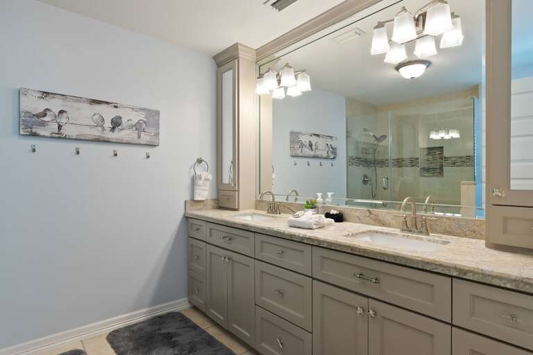 Oceanside Suite master bathroom with walk-in tile shower.