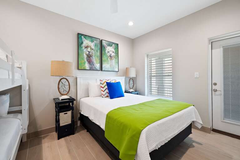 2nd Floor Guest Bedroom features direct patio access facing the pool!