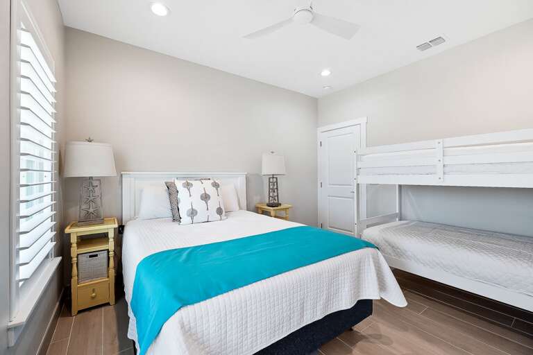 Guest bedroom with Queen bed and twin bunk beds