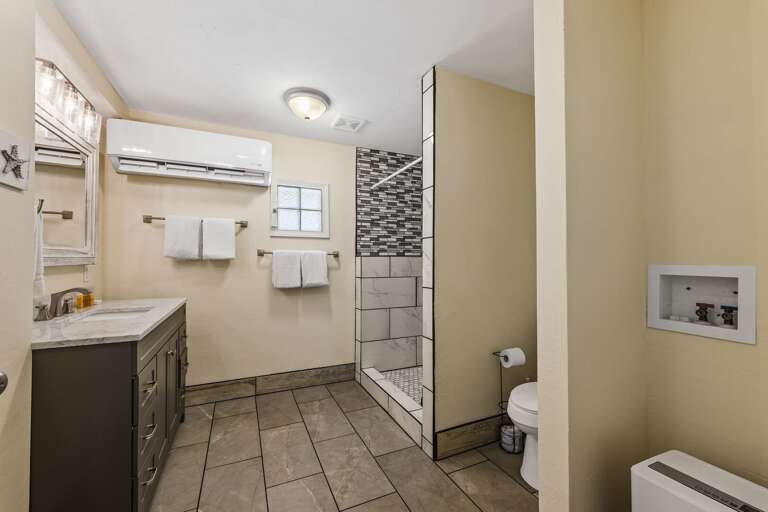 Private master bathroom with large walk-in shower.