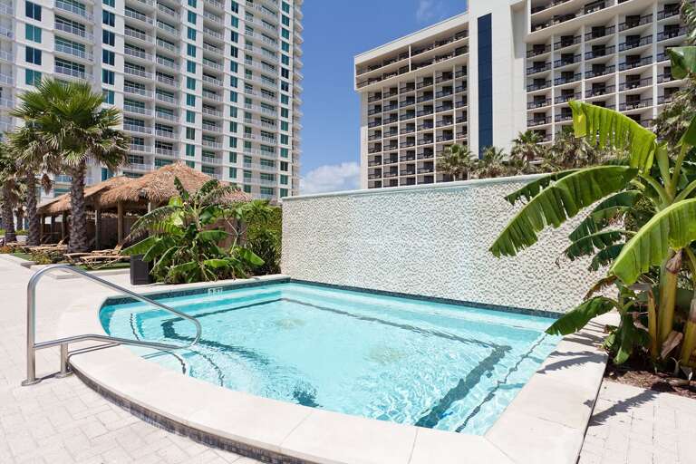 Heated resort hot tub perfect for evening relaxation under the stars.