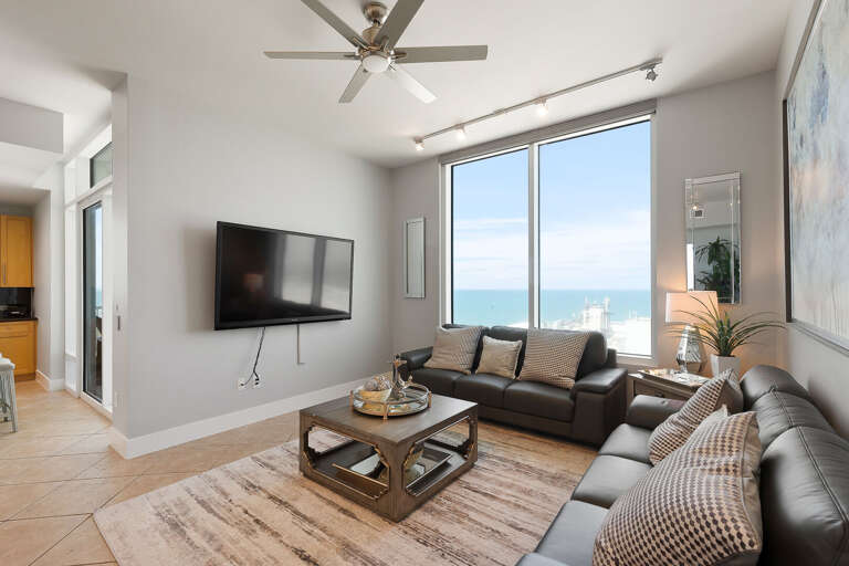 Living Area surrounds a Flat Screen TV overlooking the ocean!