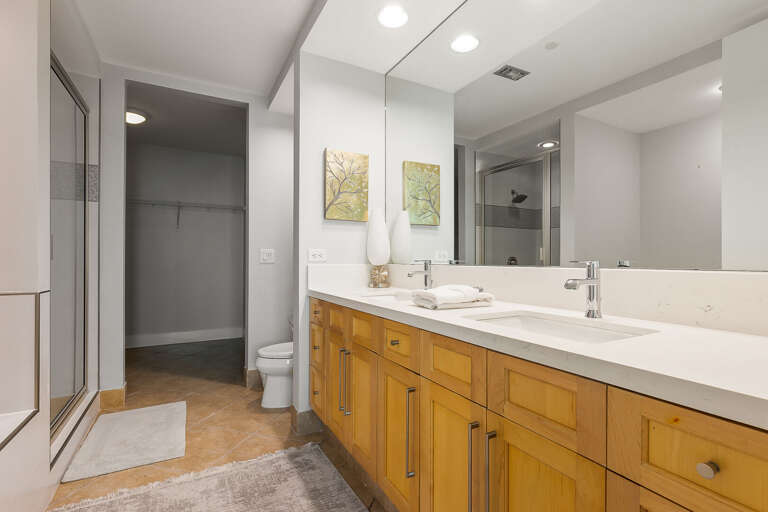 Master Bathroom with double sink features and walk-in shower