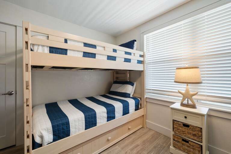 2nd guest bedroom can accommodate up to 5 people between 5 twin beds (two sets of bunk beds + one trundle).