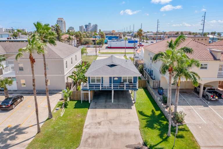 Aerial view of the front of the home. Driveway accommodates up to 4 vehicles.