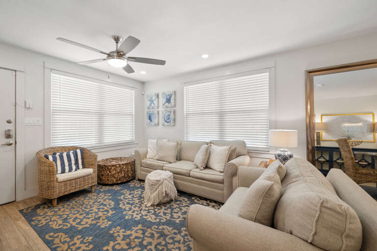 Bright living room with charming coastal decor and Queen sleeper sofa.