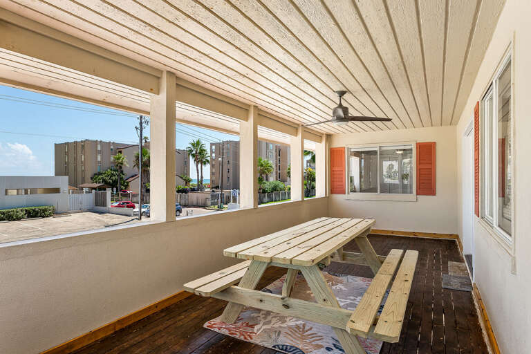 2nd Floor Balcony features ceiling fan & a picnic table. Enjoy your morning coffee, lunch, or evening nightcap!