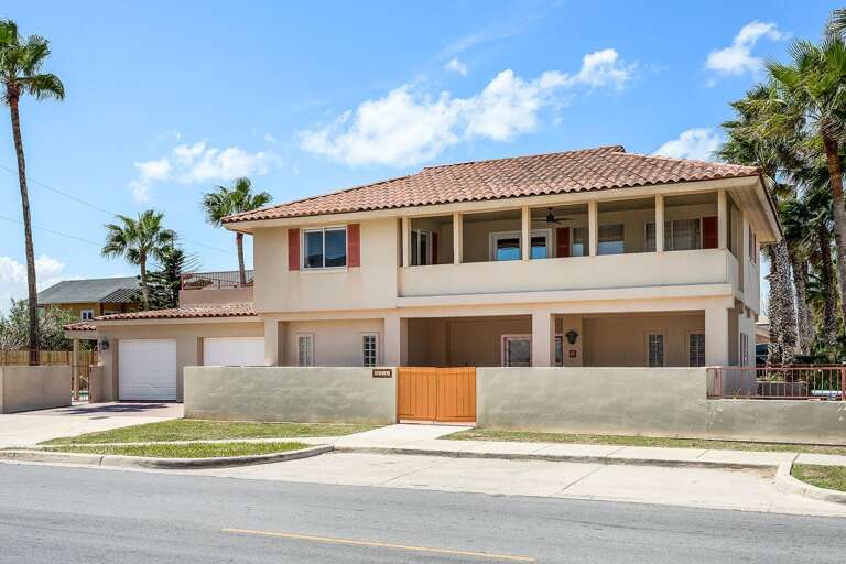 Exterior view of the front of your private beach house! The house is located just across from the beach!