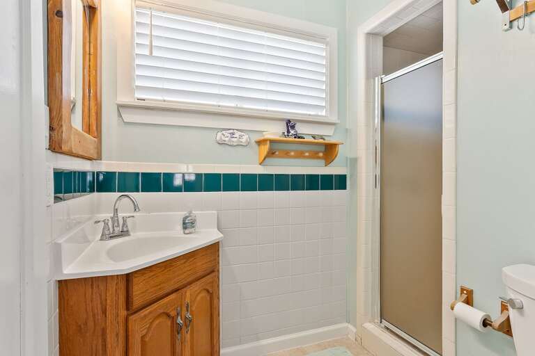 Ground floor guest bathroom with walk-in shower.