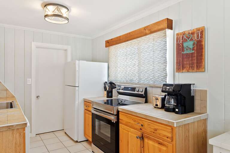 Kitchen is newly remodeled and is fully stocked with pots, pans and dishware needed for your home cooked meals.