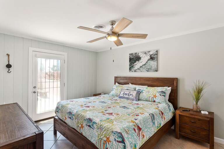 Your master bedroom (2nd floor) features a King size bed and flat screen TV. You'll also have direct access to the balcony.