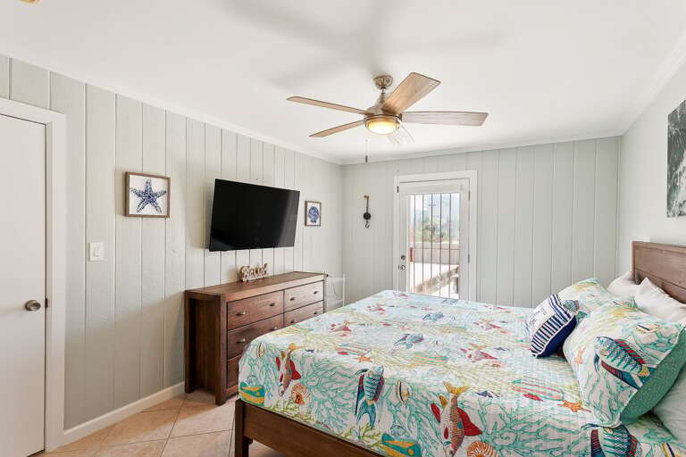 Your master bedroom (2nd floor) features a King size bed and flat screen TV. You'll also have direct access to the balcony.