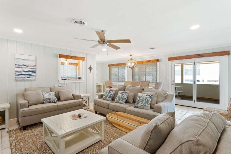 Open concept living and dining area. Ample seating for you and your guests around a flat screen TV.