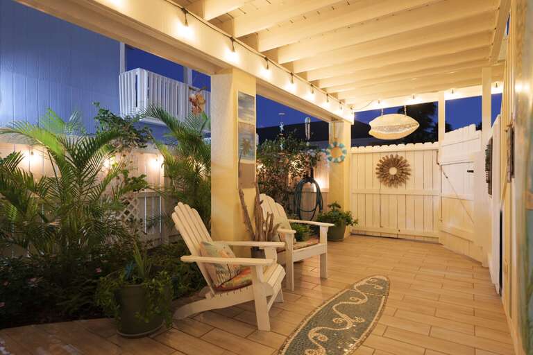 Fenced in patio located on the ground level is perfect to enjoy the island climate Fenced in patio located on the ground level is perfect to enjoy the island climate