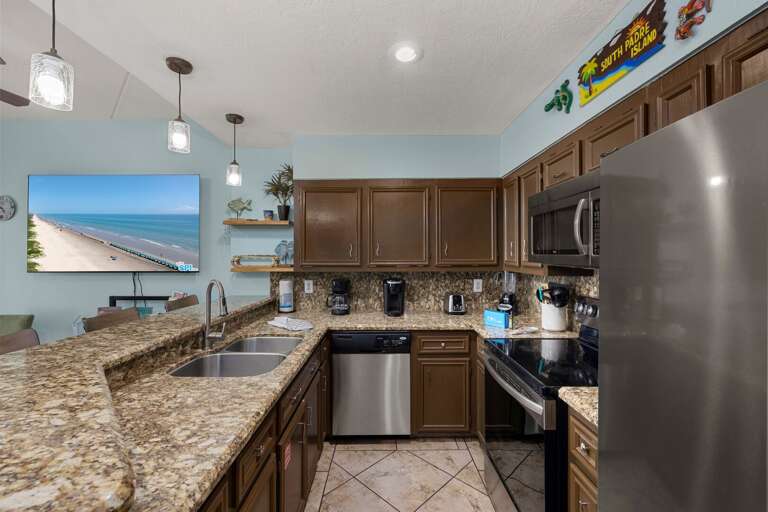 Granite Countertops, Stainless Steel Appliances, Wall Art, Beach View On TV