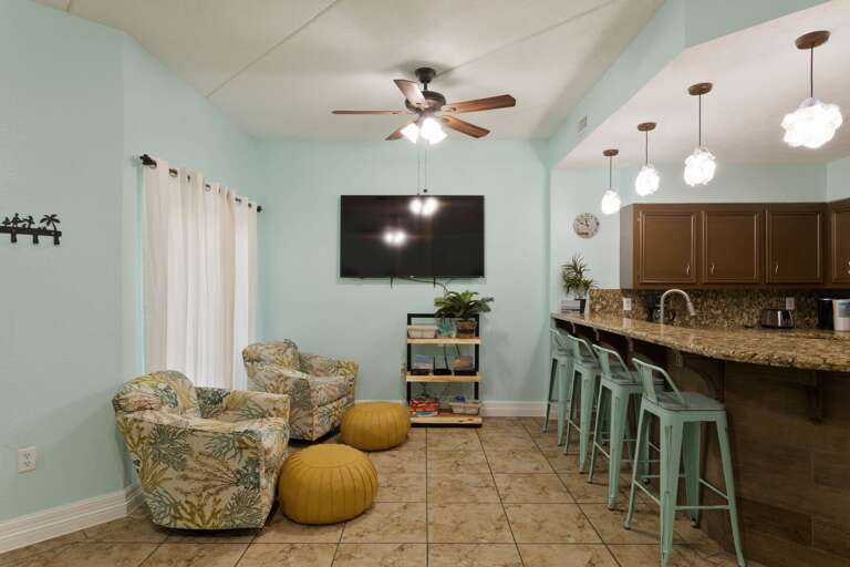 Open concept kitchen and living area surrounds a large flat screen TV ! Open concept kitchen and living area surrounds a large flat screen TV !