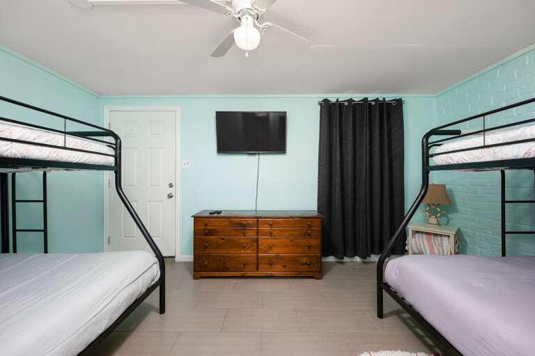 1st Floor Guest Bedroom features 2 sets of Twin over Full Bunk Beds