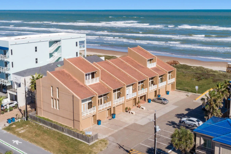 Just steps from the beach, this spacious four-story townhome is the perfect home base for your South Padre Island getaway.