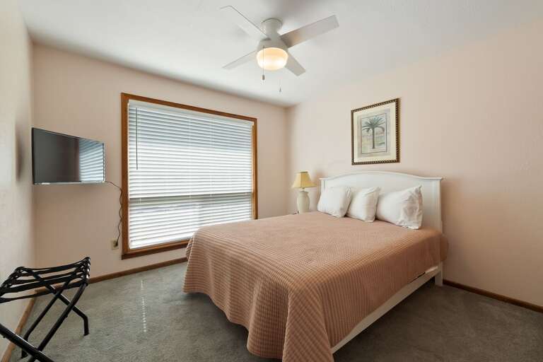 Guest bedroom with Queen bed and flat screen TV (room #4, 2nd floor)