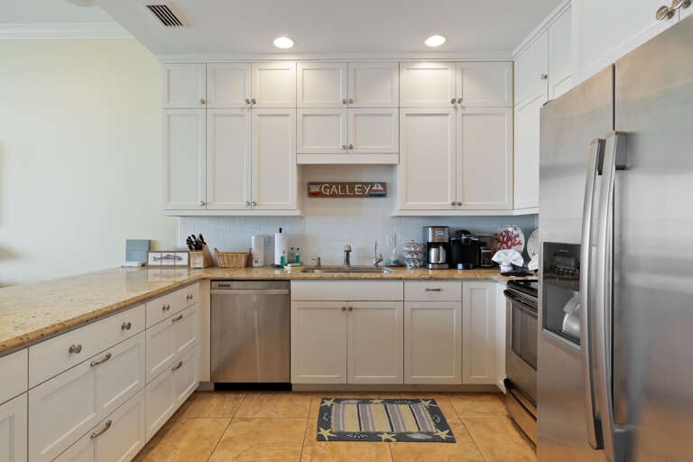 Fully equipped kitchen area with pots, pans, and dish ware essential for cooking your favorite meals