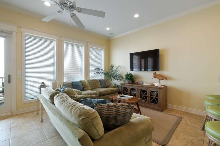 Large Flat Screen TV with ample seating perfect for family movie nights!