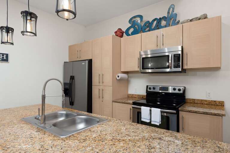 Kitchen Interior With Cabinets, Appliances, And Counter