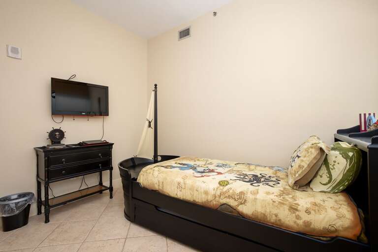 Guest Bedroom with a twin bed and flat screen TV