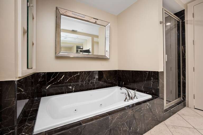Master Bathroom features an over soaking tub and walk-in shower