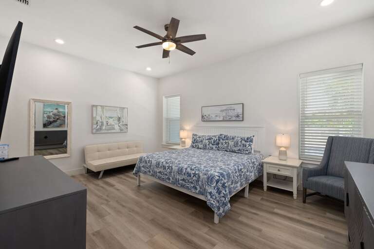 The spacious ground-floor primary suite offers a king bed and a peaceful place to recharge after a fun-filled day.