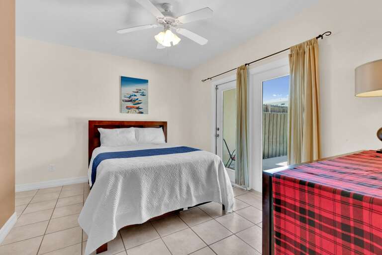 Second bedroom with Queen size bed and direct pool access.