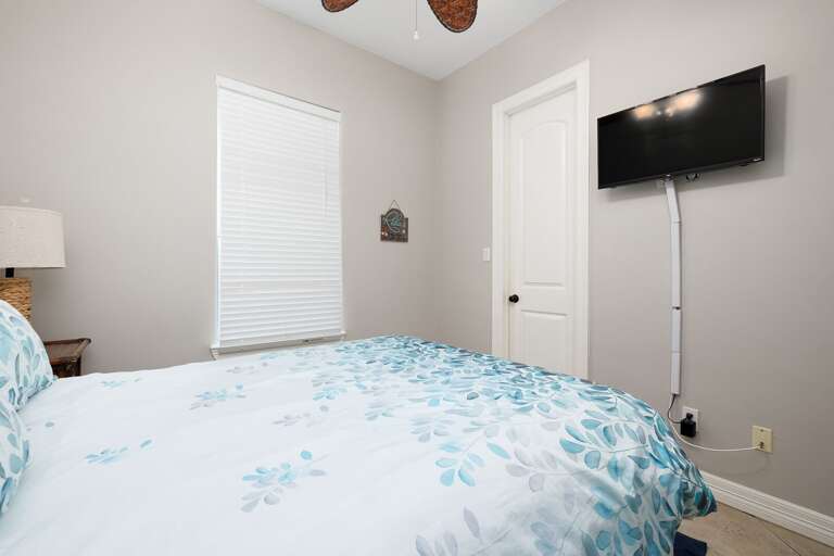Guest bedroom features a flat screen TV