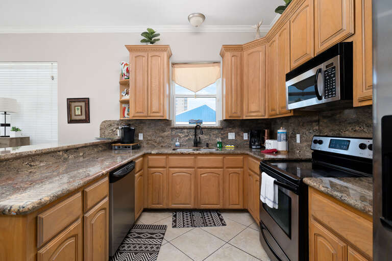 Kitchen Area fully equipped with essentials to prepare your favorite home cooked meal