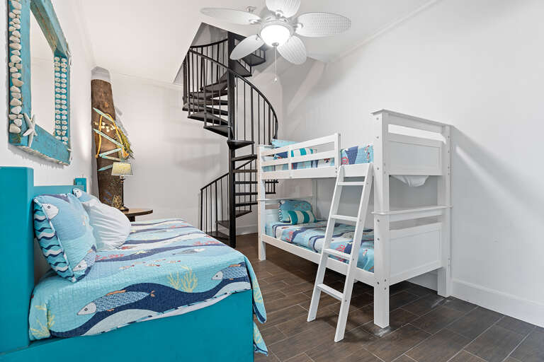 Bedroom With Bunk Beds And Spiral Staircase