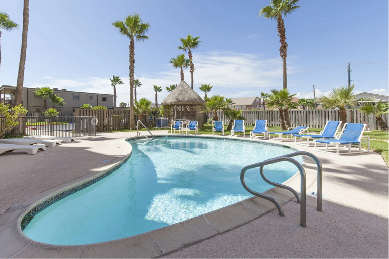 Spend the afternoon lounging beside the sparkling beachfront pool.