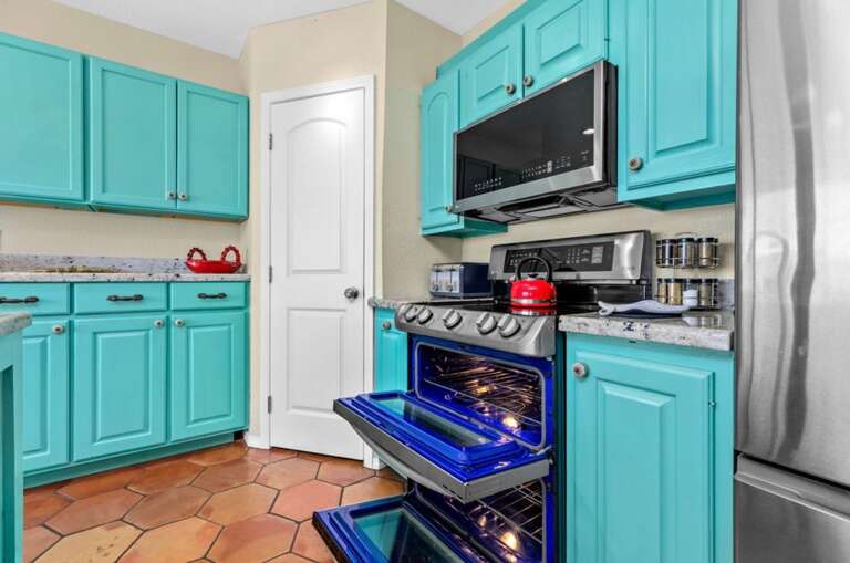 Turquoise Kitchen Interior With Appliances