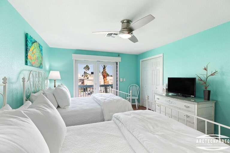 Bedroom With Turquoise Walls, White Furniture, And Ceiling Fan