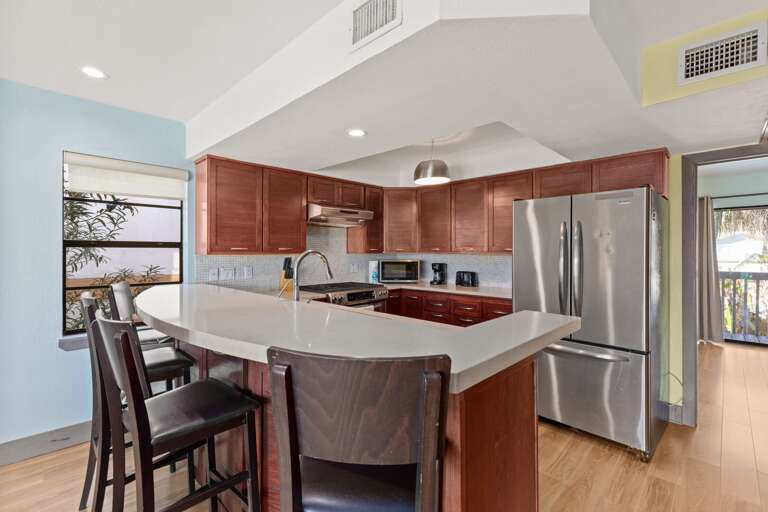 Interior Of A Kitchen With Island And Stools