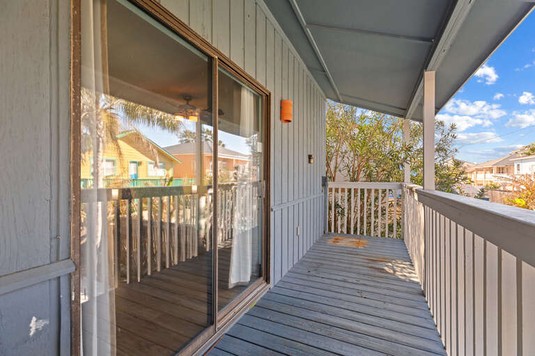 Balcony access from Bedroom 2 towards pool area