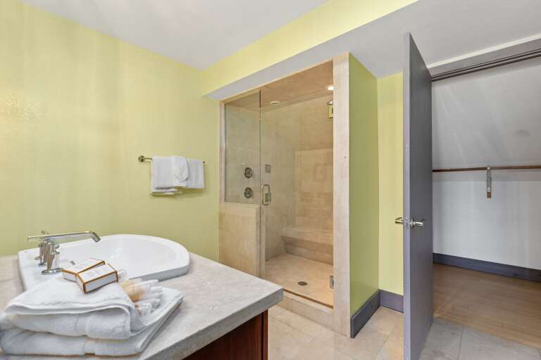 Bathroom 1 featuring walk in shower.