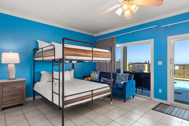 Downstairs Guest Bedroom with full bunk beds features direct pool access Downstairs Guest Bedroom with full bunk beds features direct pool access