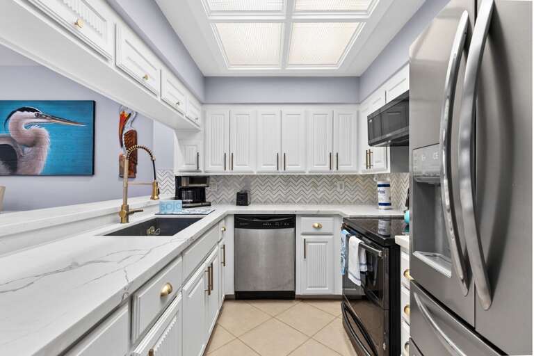 Fully equipped kitchen area with stainless steel appliances Fully equipped kitchen area with stainless steel appliances