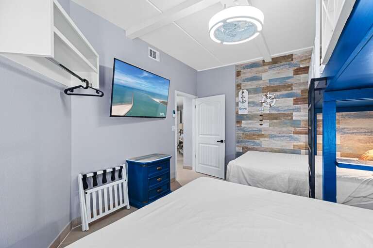 Twin over queen bunk bedroom features a flat screen TV Twin over queen bunk bedroom features a flat screen TV