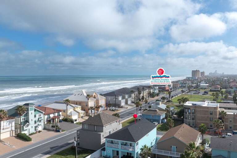 Seaside Street Scene Surf-side With Scattered Structures Under Spacious Skies