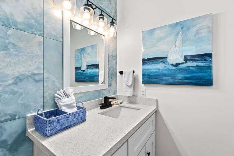 Half bathroom located on the ground floor off the patio and pool area.